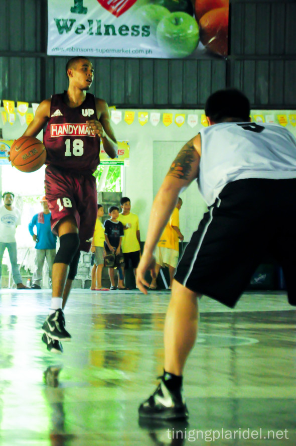 Center Matthew Ball warms up in an exhibition game of the UP Men's Basketball Team against Global Port Batang Pier last June 15. Photo by Anjon Galauran