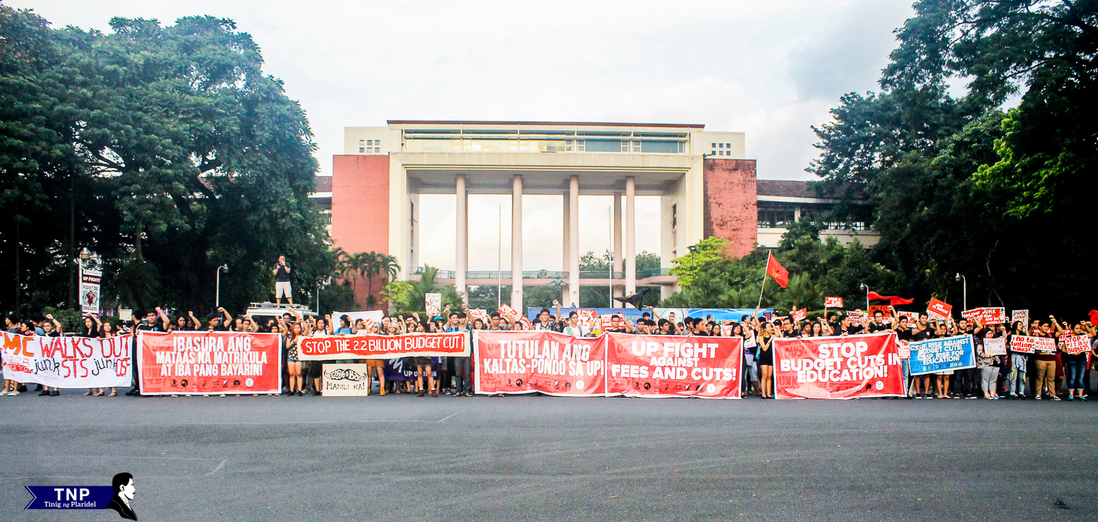 Students gather in front of Quezon Hall to protest against the impending P2.2-billion cut in UP's budget for 2016. 